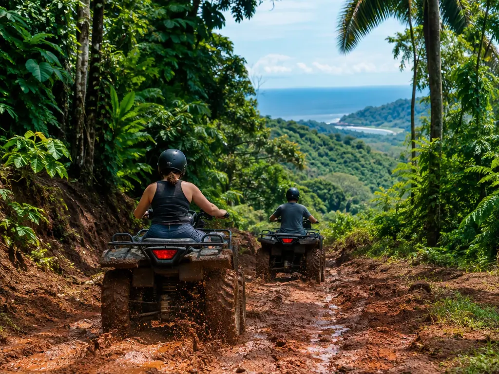 Two ATVs on a muddy jungle trail in the hills above Jaco